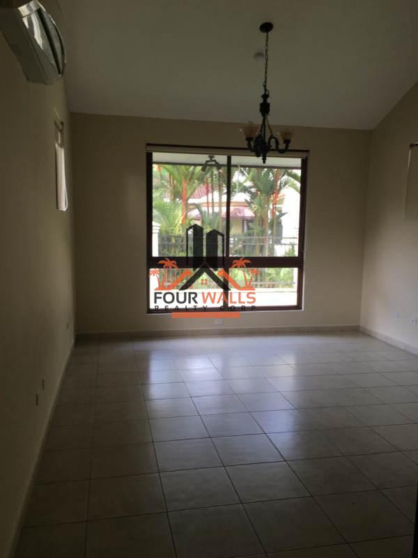 Covered porch with stone columns tiled roof lush garden PH Camino de Cruces Clayton Panama