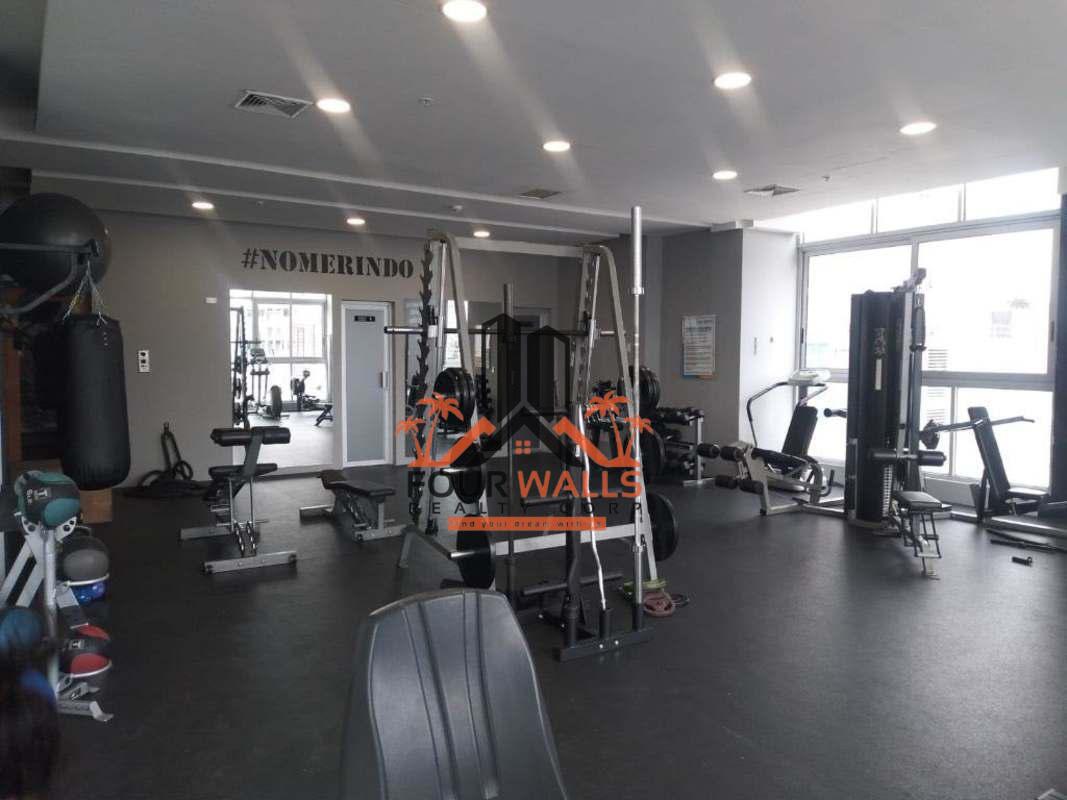 Modern gym with exercise machines in PH La Mare Panama City
