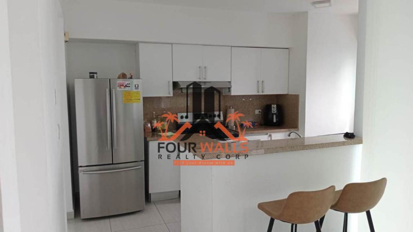 Living dining space with large windows and ocean views PH La Mare Coco del Mar Panama