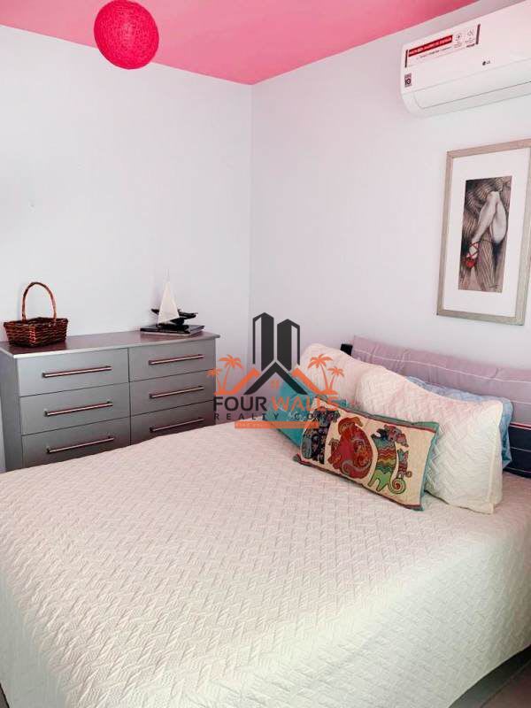 Bedroom with large window overlooking city in PH Bay View Avenida Balboa Panama