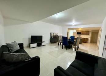 Spacious open floor plan living dining with sofas dining set view to kitchen Las Villas de Arraiján Panama