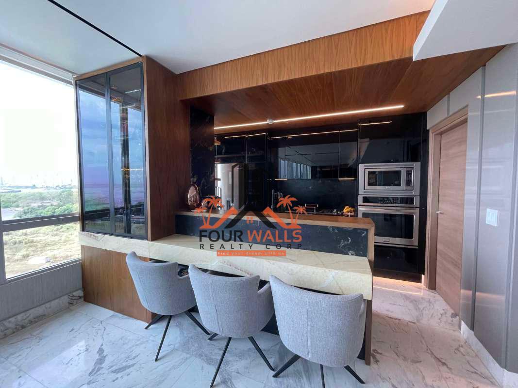 Spacious kitchen with granite countertops and fine finishes in luxury apartment at Costa del Este Panama