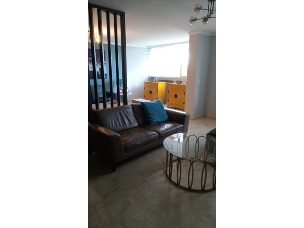 Spacious living and dining room with large windows and ocean view at Costa Pacifica Punta Pacifica Panama