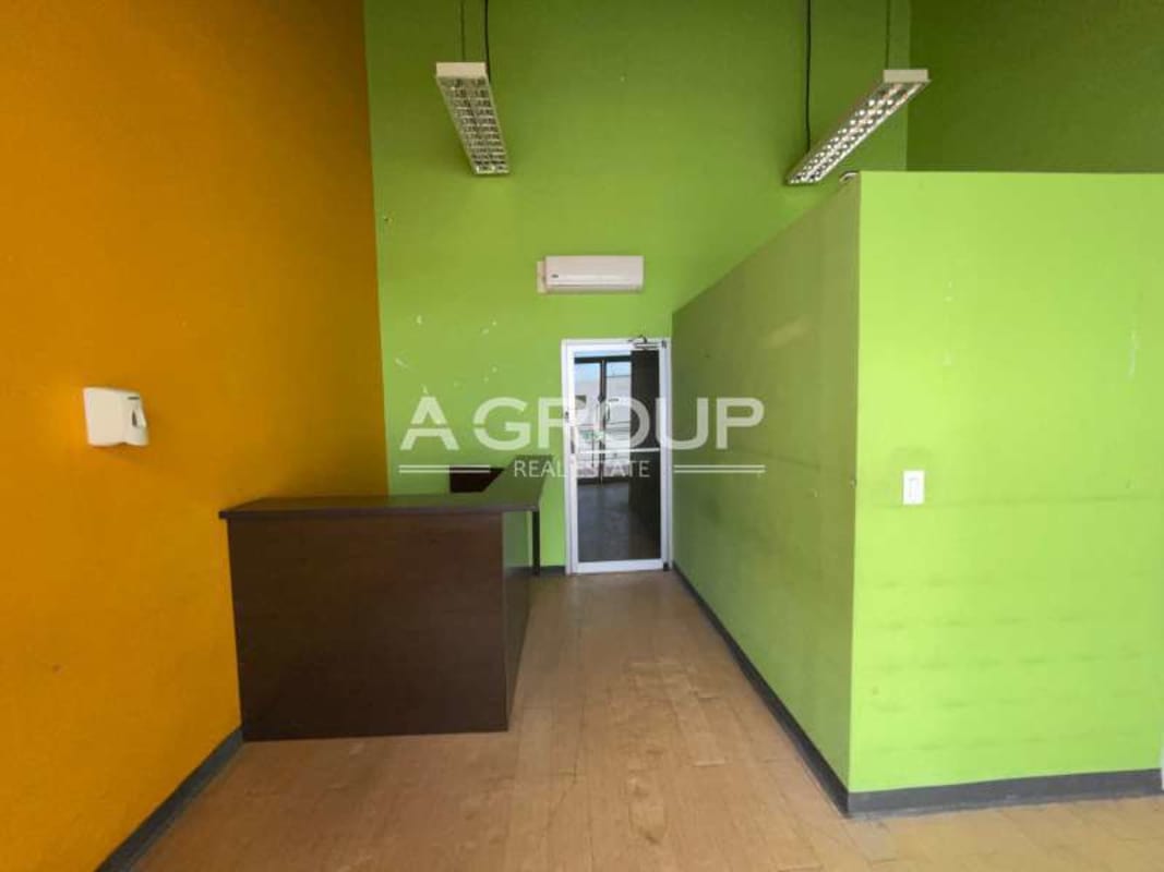 Reception and entrance glass door inside commercial retail space Plaza Brisas 507 Brisas del Golf Panama City