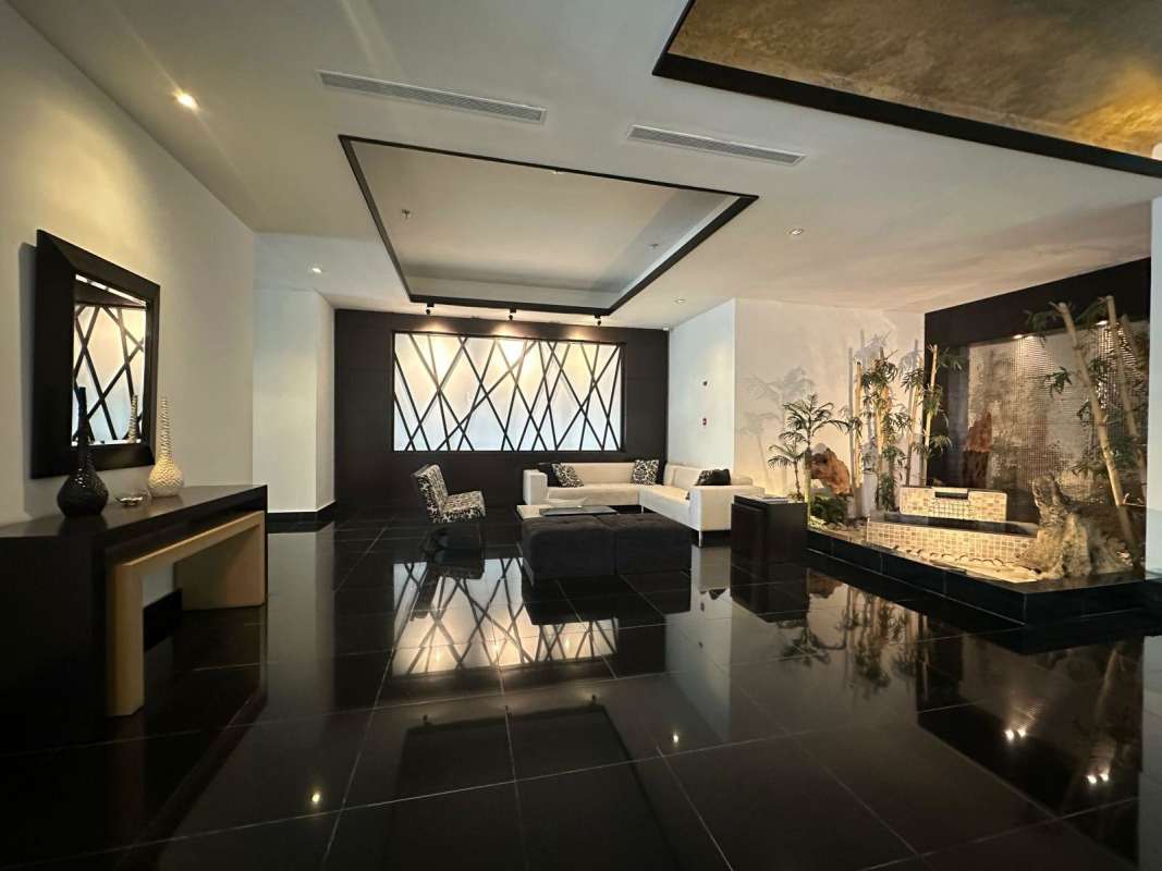 Modern lobby with designer furniture and water feature PH Venetian Tower Coco del Mar Panama