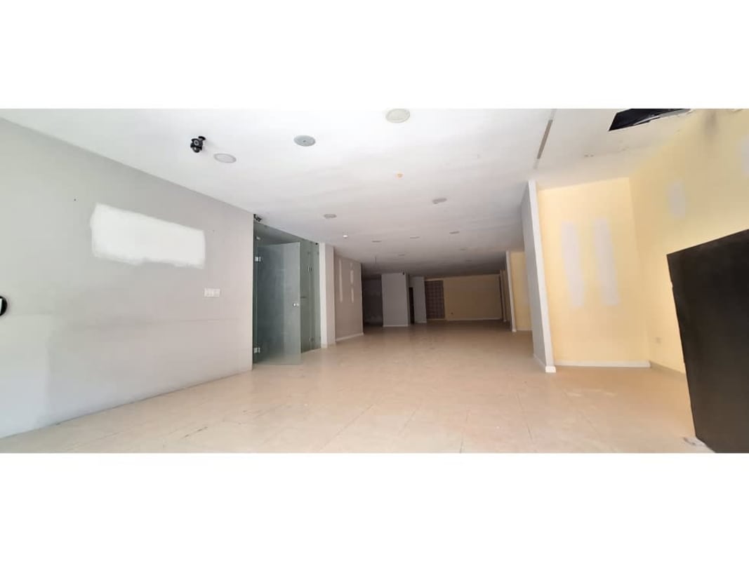 Bright empty commercial unit with tiled floors, large storefront windows in Panama City
