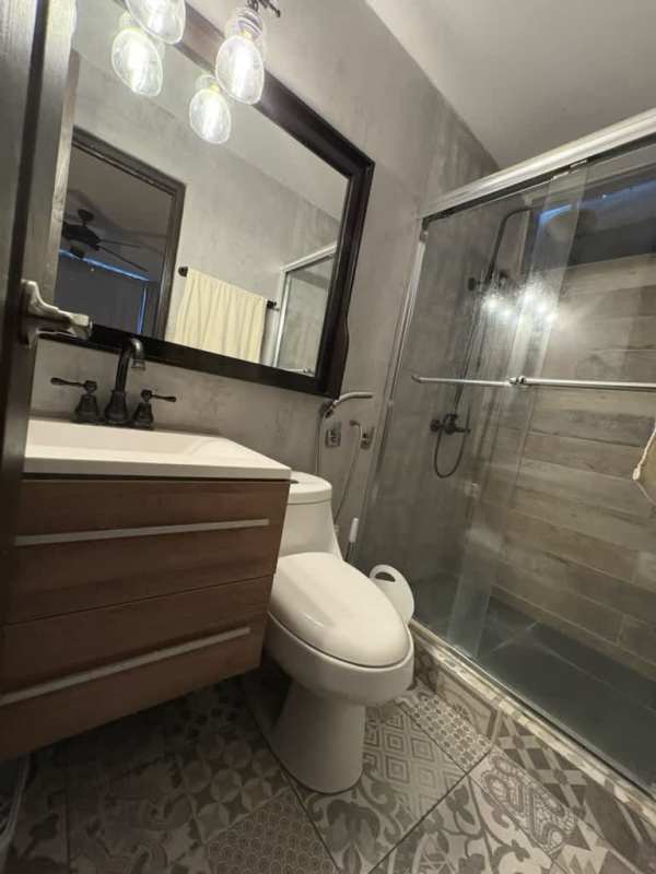 Enclosed kitchen with granite-style counters, overhead cabinets, and appliances at PH San Francisco Panama City