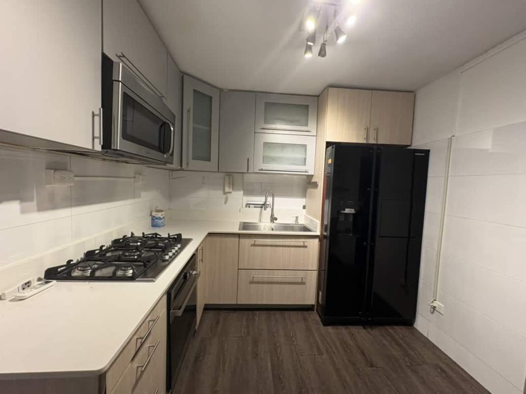 Modern bathroom with tiled shower enclosure and vanity at PH San Francisco Panama City