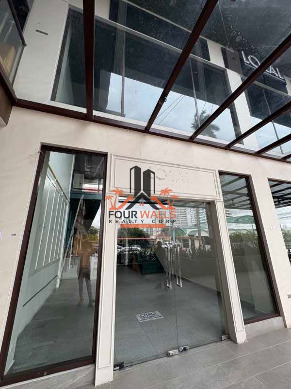 Empty tiled industrial prep room with metal shelving ready for customization in commercial space Panama