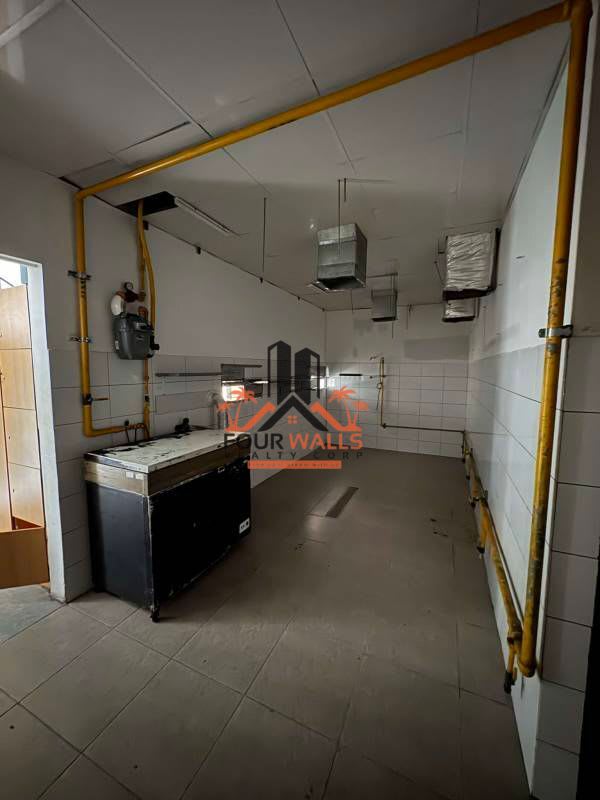 Industrial tiled utility or prep room with gas piping and ventilation commercial lease Panama