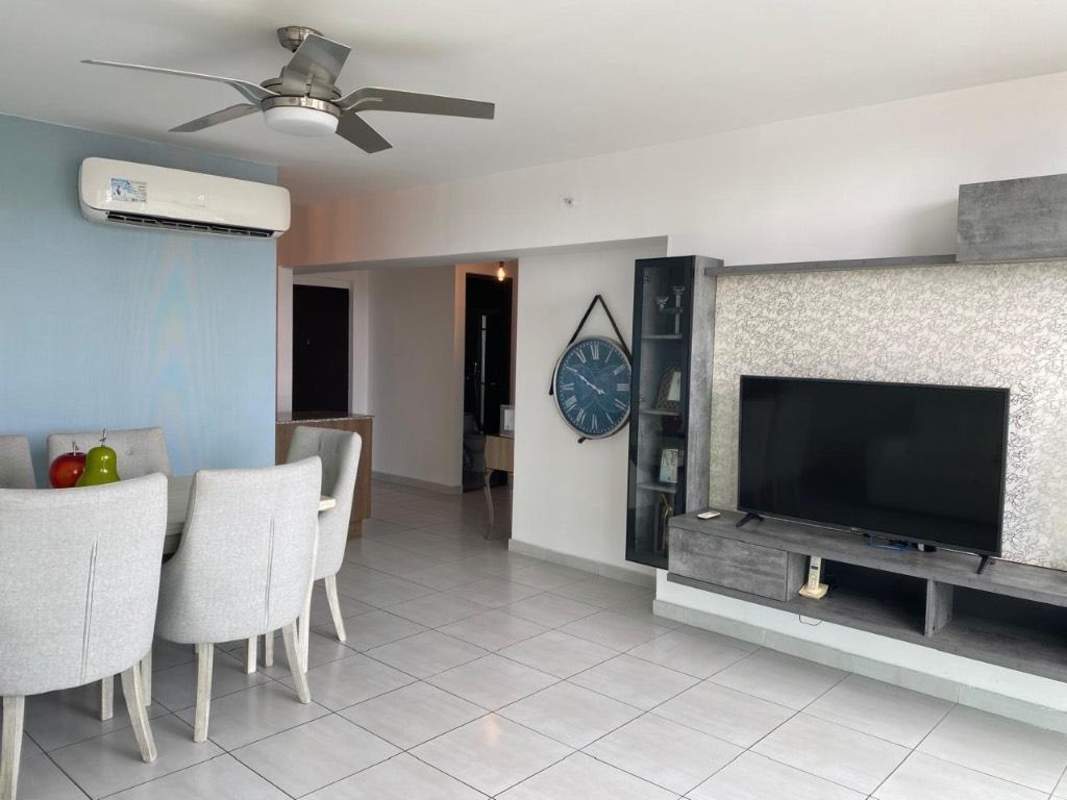 Modern kitchen with granite countertops, gas stove, microwave, laundry space in El Cangrejo Panama