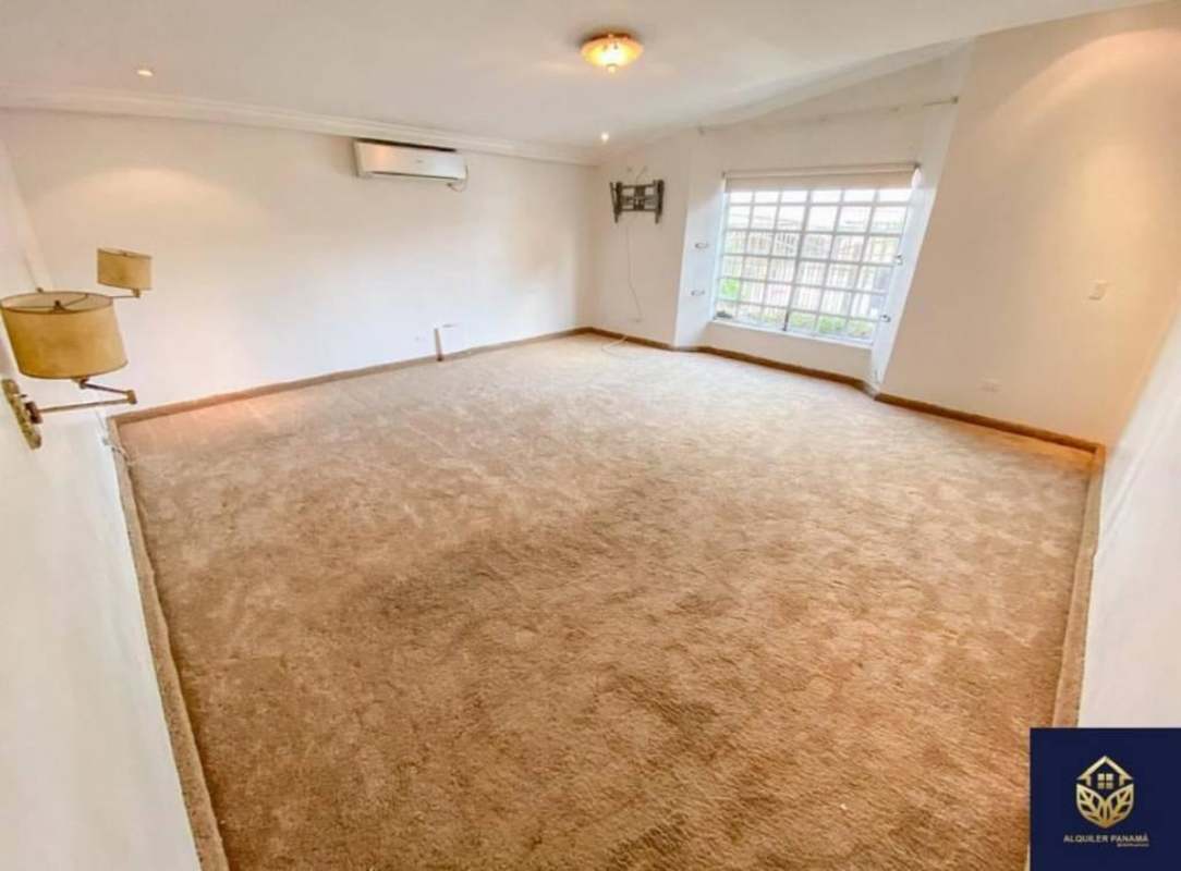 Large empty living room with air conditioning and garden view in El Dorado villa Panama rental