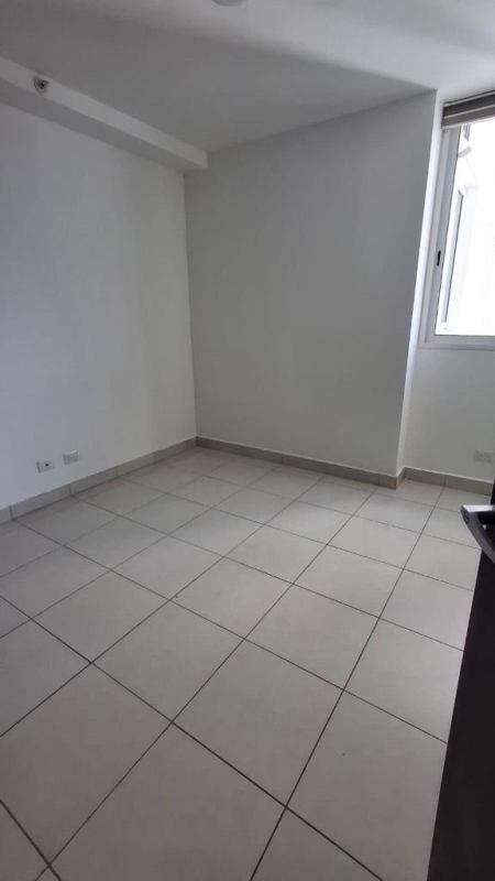 Sunlit bedroom with ceramic tile flooring and window in PH Clayton Park 2 Panama