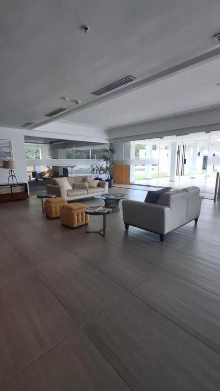 Modern lobby with glass doors, sofas, and reception area at PH Clayton Park 2 Panama