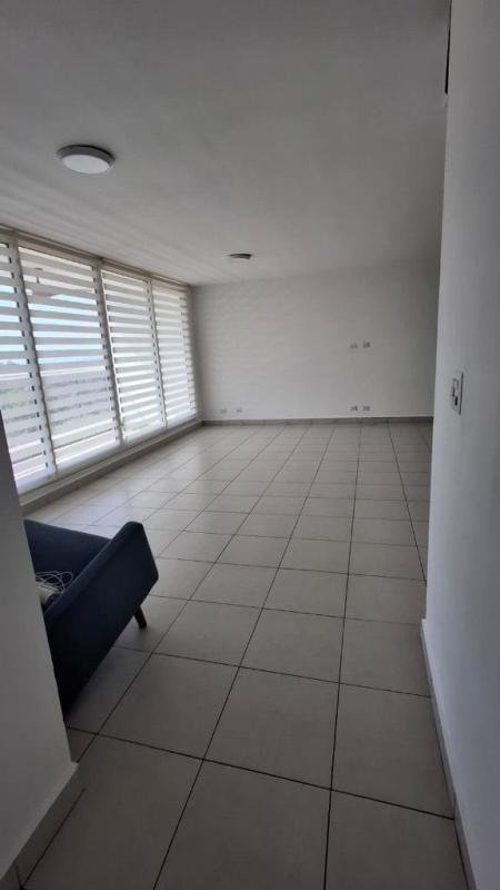 Spacious living room with tile floor and large windows in PH Clayton Park 2 Clayton Panama