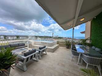 Luxury penthouse kitchen with large quartz island and stainless appliances Buenaventura Panama