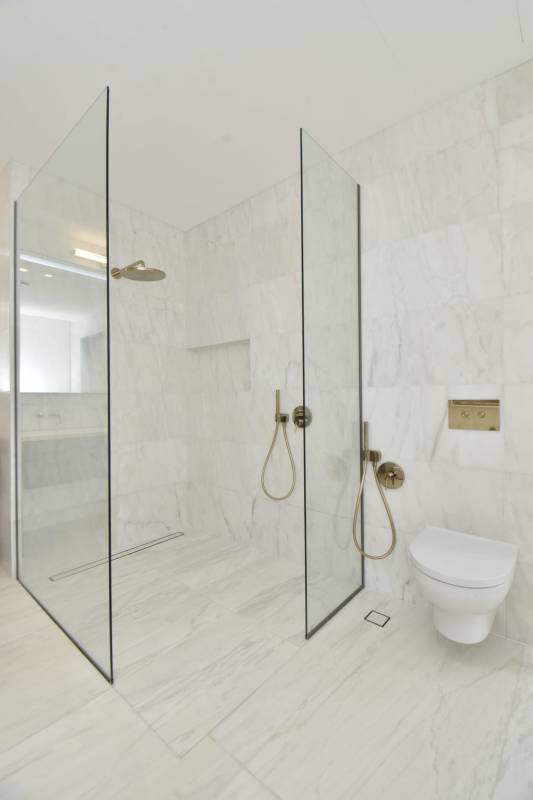 Spacious luxury master suite in Santa Maria Panama with panoramic floor-to-ceiling windows overlooking golf and sea