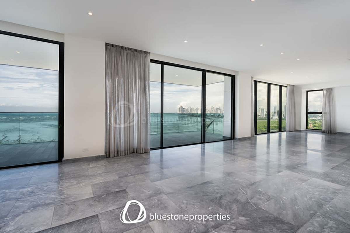 Open modern kitchen with stainless appliances, granite island and built-ins in PH Acqua Costa del Este Panama