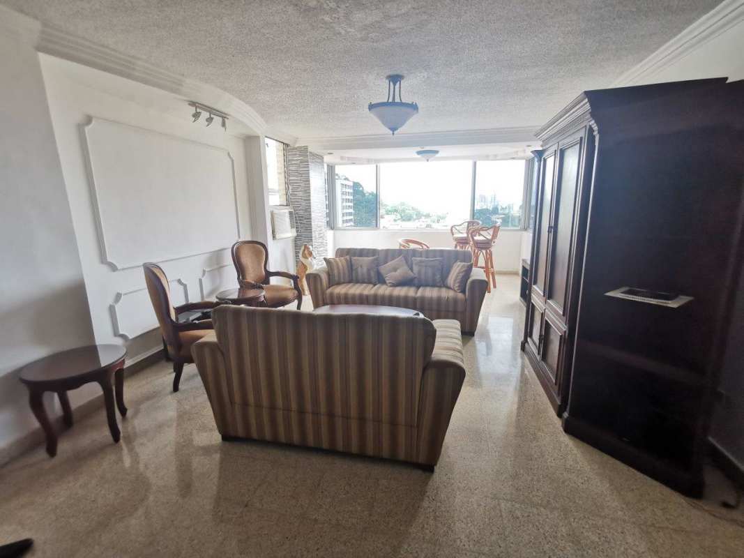 Large living-dining area with panoramic window views, ceramic tile floors, natural light in PH Fuente de los Cibeles El Dorado Panama