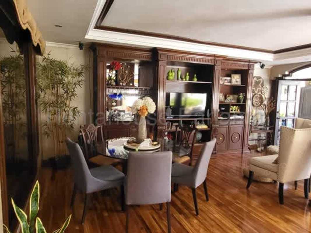 Large living area with hardwood floors wooden entertainment unit El Carmen Panama