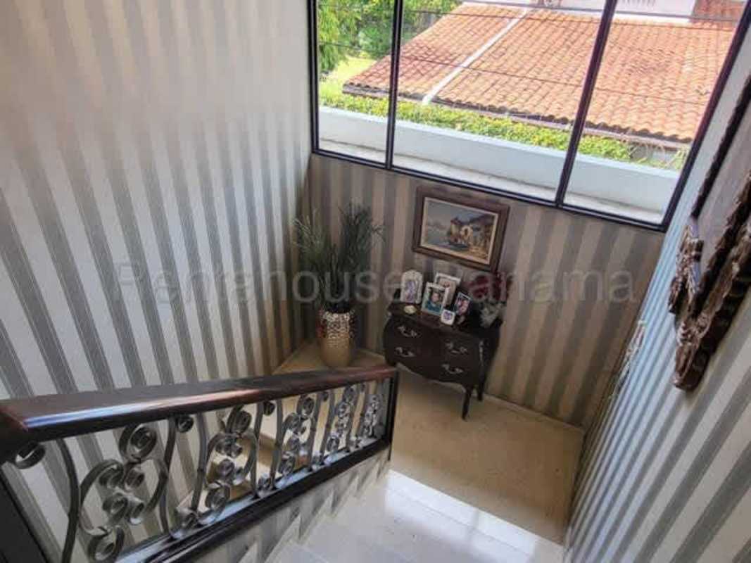 Stair landing with ornate decor natural light in house Panama El Carmen