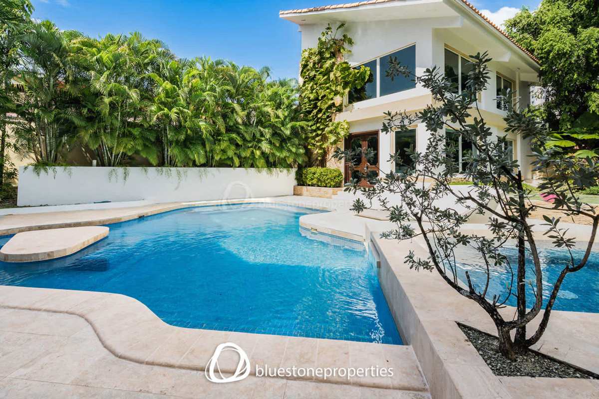Two-story modern tropical villa with lush landscaping and private pool in Panama City