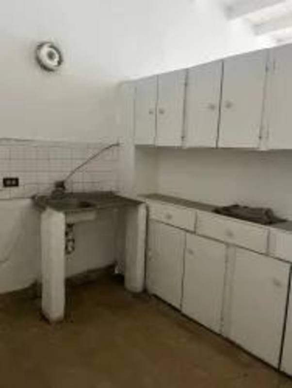 Multi-use unfinished open area with exposed beams and partition wall in Santa Ana property Panama