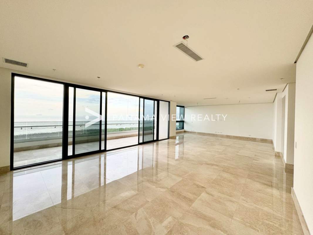 Large modern kitchen with island, marble countertops and sea view windows at PH Matisse Panama