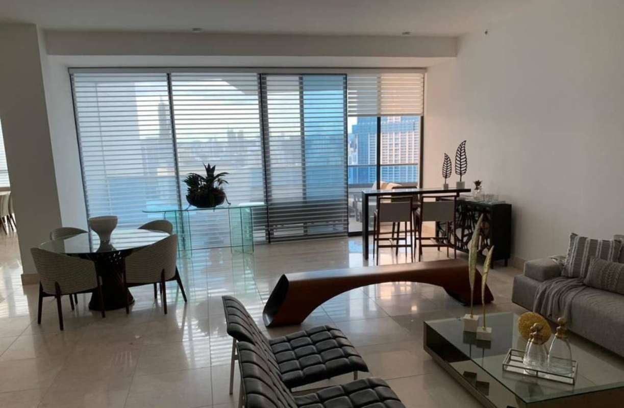 Large furnished balcony with panoramic ocean and city skyline views at PH Platinum Tower Paitilla Panama