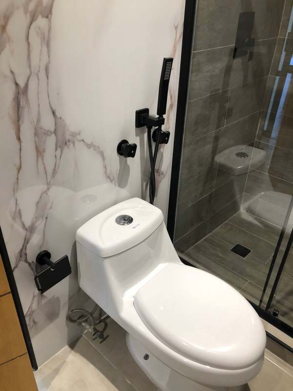 Covered terrace balcony with tile wall and city views PH Ipanema Punta Paitilla apartment