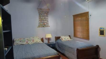 Gated entrance with lush garden of Coronado beach rental house Panama