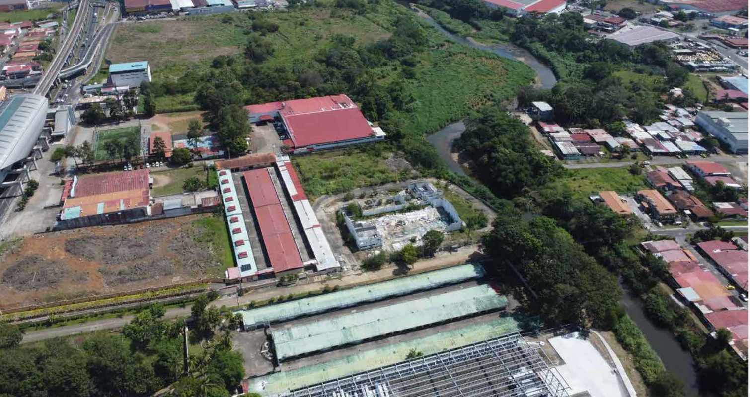 Aerial image with mixed development near metro station, highway and river in Panama City