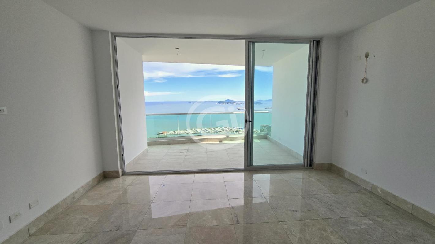Modern minimalist kitchen featuring large window, light cabinetry, double sink in Costanera Tower South Panama City