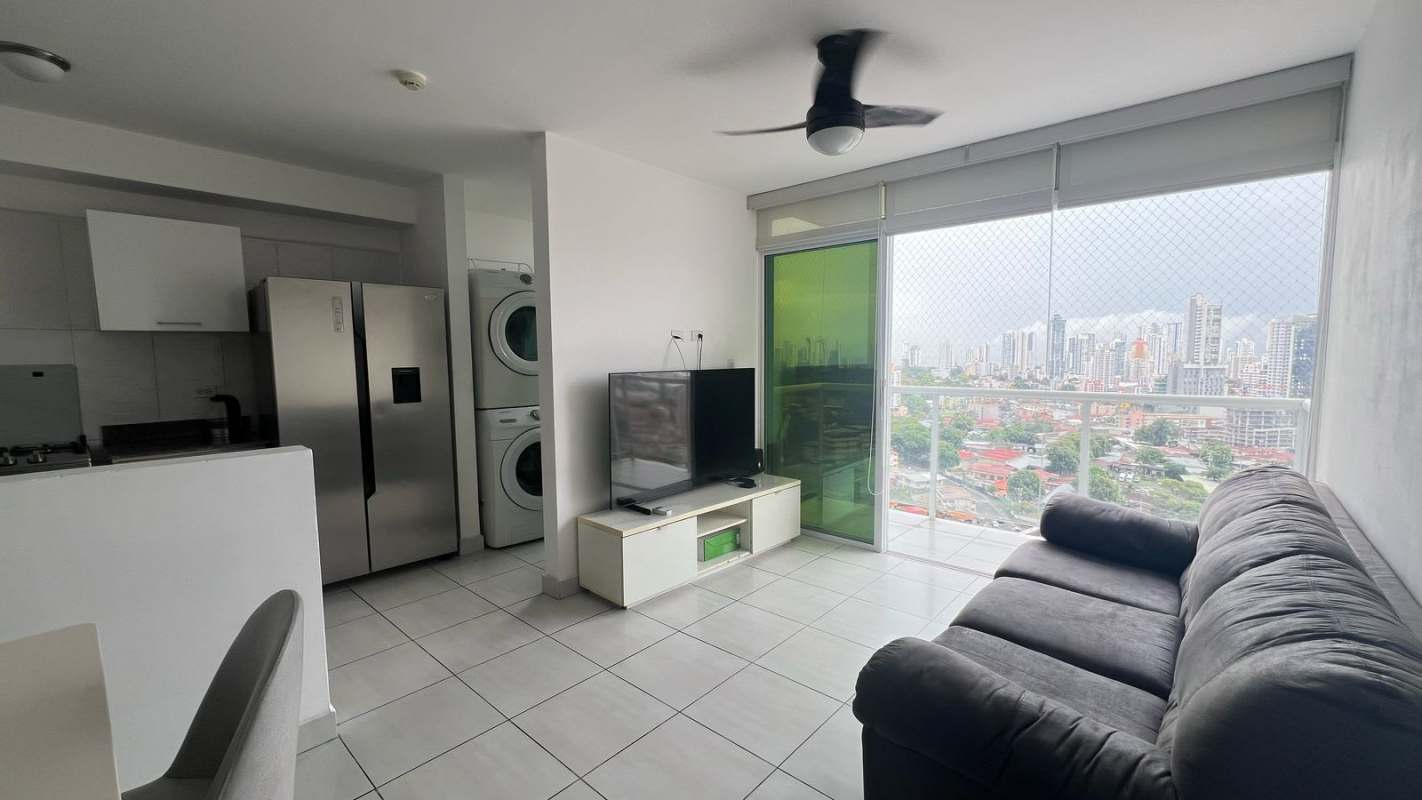 Open plan living dining area with balcony and city views, PH Metropolitan Park Panama