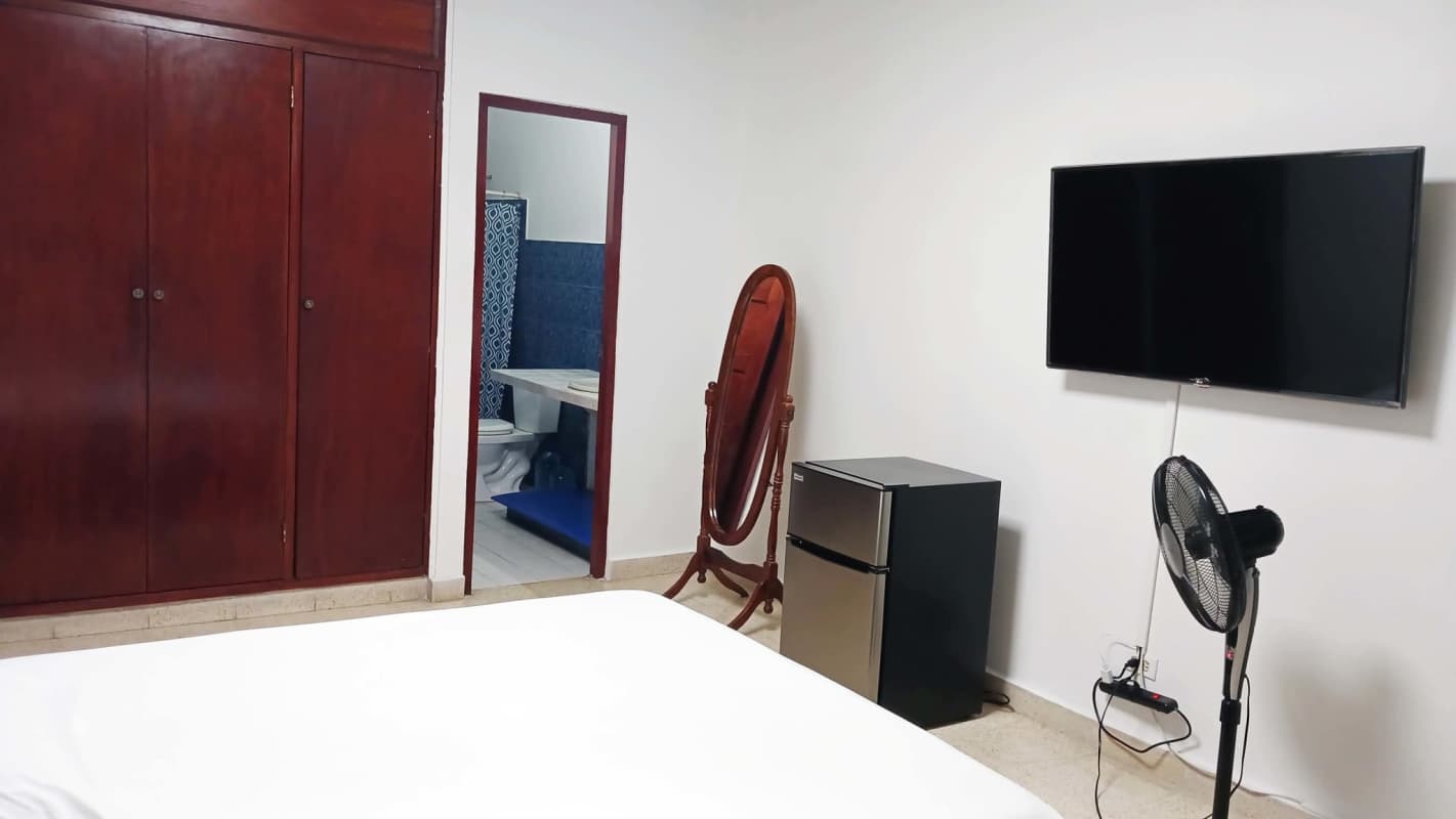 Bedroom for rent with closet, smart TV, mini fridge and en suite bathroom in Chanis Panama
