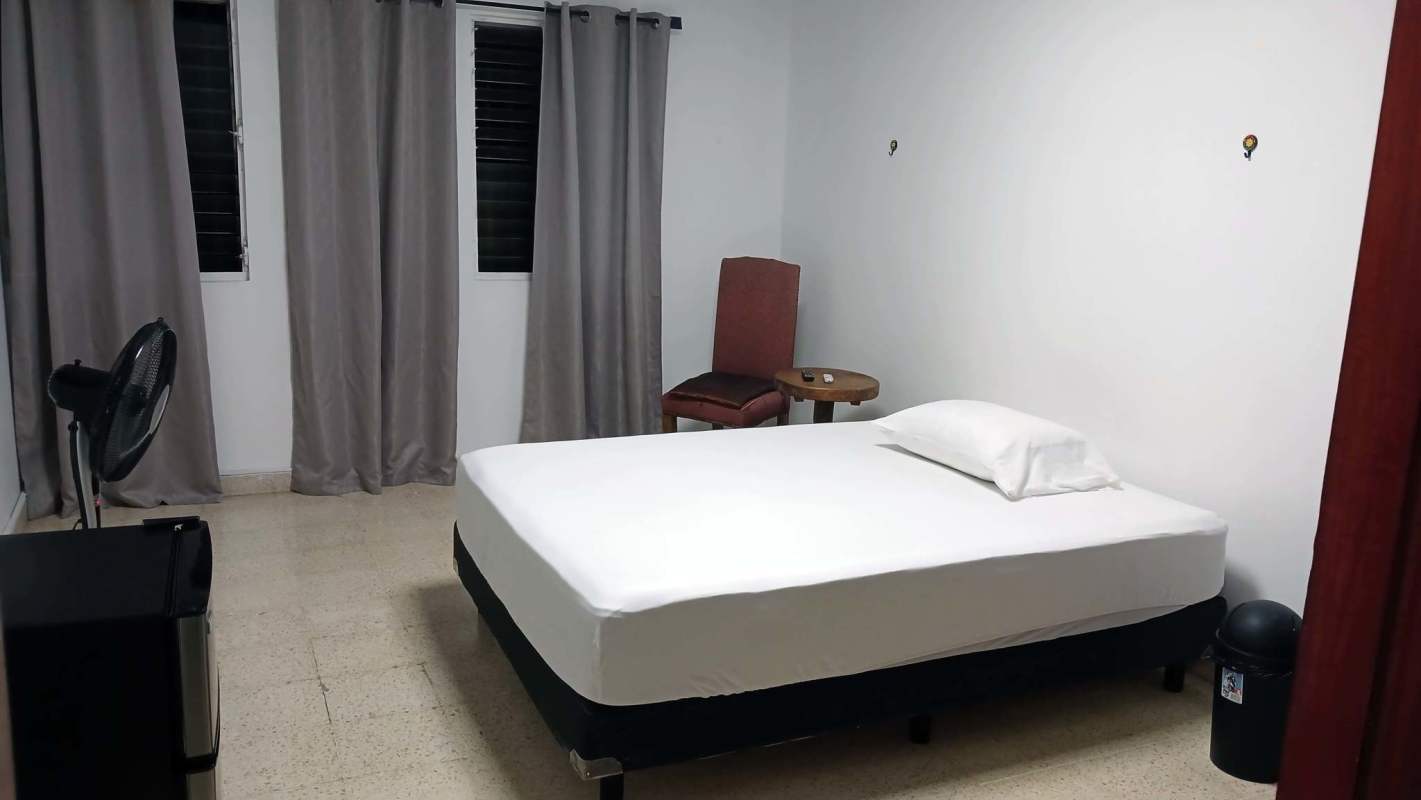Furnished room with bed, fridge, fan, private bathroom Chanis Panama rental