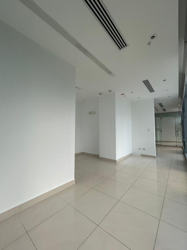 Reception area with glass-walled private offices Edificio Banco Panamá Costa del Este