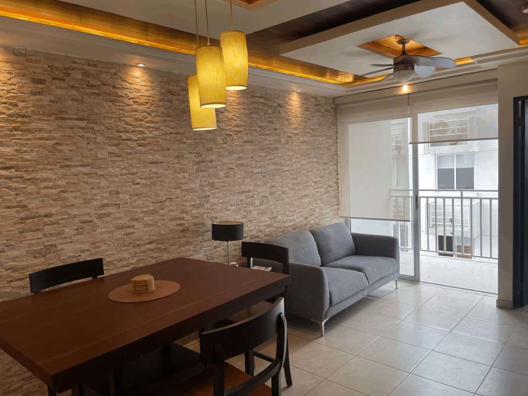 Modern open living dining with accent wall, sofa, dining set PH El Doral 12 de Octubre Panama