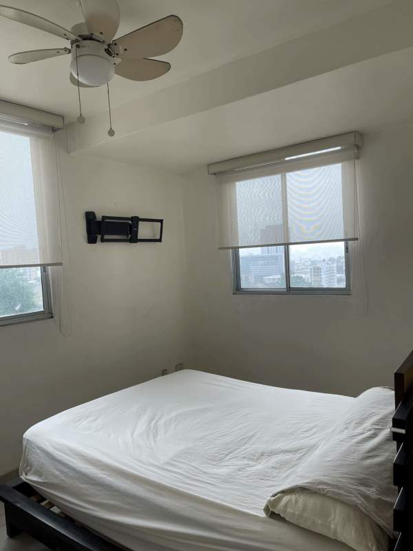 Bedroom with window, ceiling fan, split AC at PH El Doral in Panama City