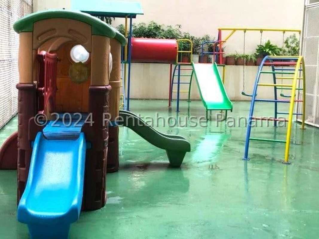 Secure colorful playground with slides and swings area in PH Punta del Sol Punta Paitilla Panama