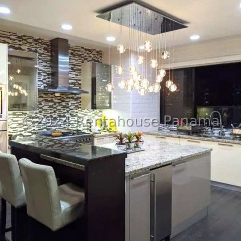 Gourmet kitchen with granite countertops, pendant lighting, island and stainless appliances Punta del Sol Panama