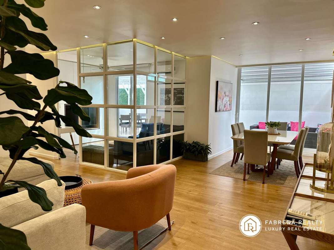 Modern furnished living room with natural light and terrace access in PH Window Tower Coco del Mar