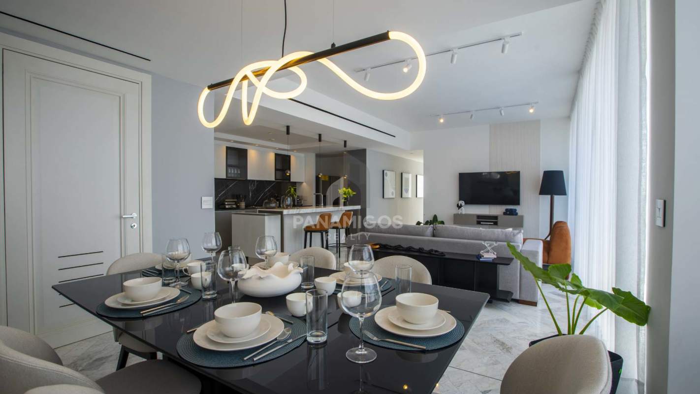 Spacious living room with panoramic ocean and city views at Wanders & Yoo Panama