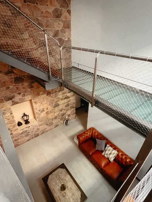 Granite kitchen island, stainless appliances, pendant lighting in loft penthouse PH Casco Antiguo Casco Viejo Panama