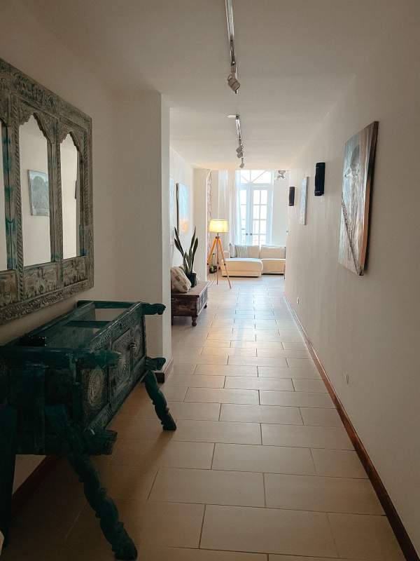 Metal mezzanine loft walkway overlooking open living area PH Casco Antiguo Panama