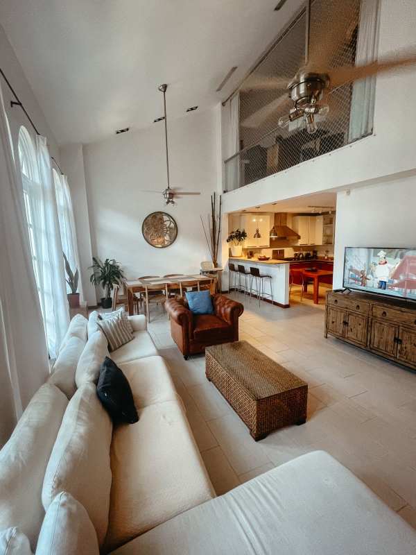 Open plan living-dining and kitchen area with loft double height ceilings PH Casco Antiguo