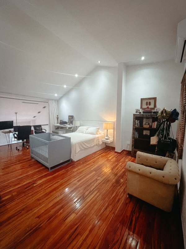 Large bedroom with vaulted ceiling, workspace, wood floors in PH Casco Antiguo Casco Viejo Panama