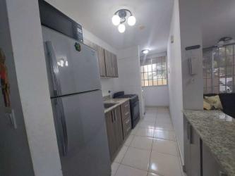 Kitchen with granite countertops, tile floors, overhead cabinets PH Terrazas del Oeste Panama