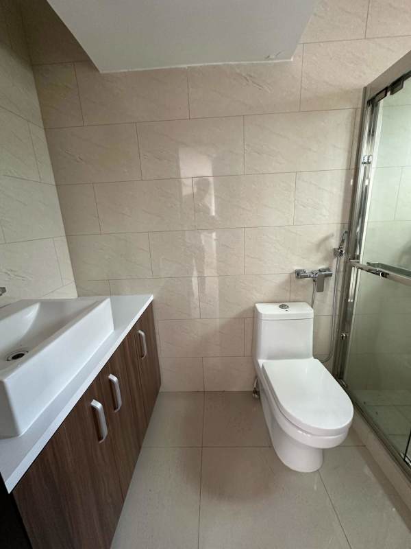 Brand-new open kitchen with cabinetry and appliances at PH Vicky Village in Panama City