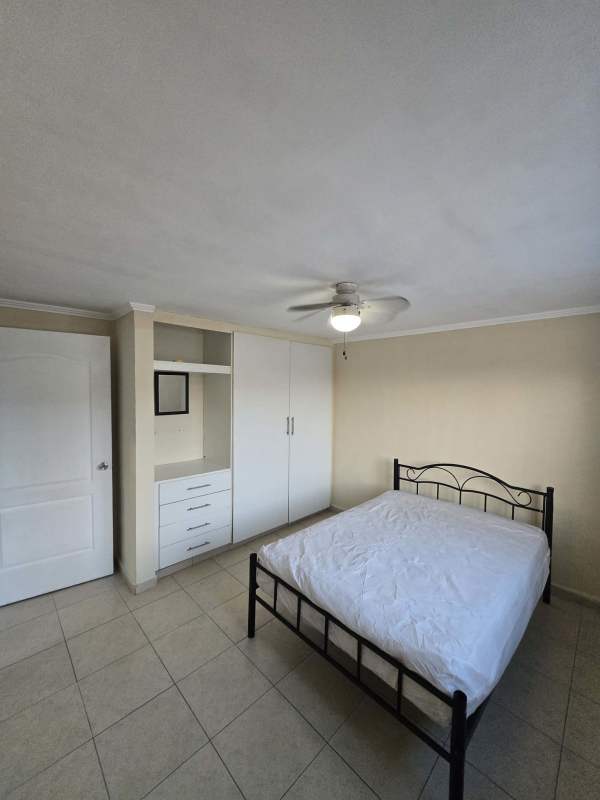 Second bedroom with bed, wardrobe, fan, tiled floor Rio Abajo Panama